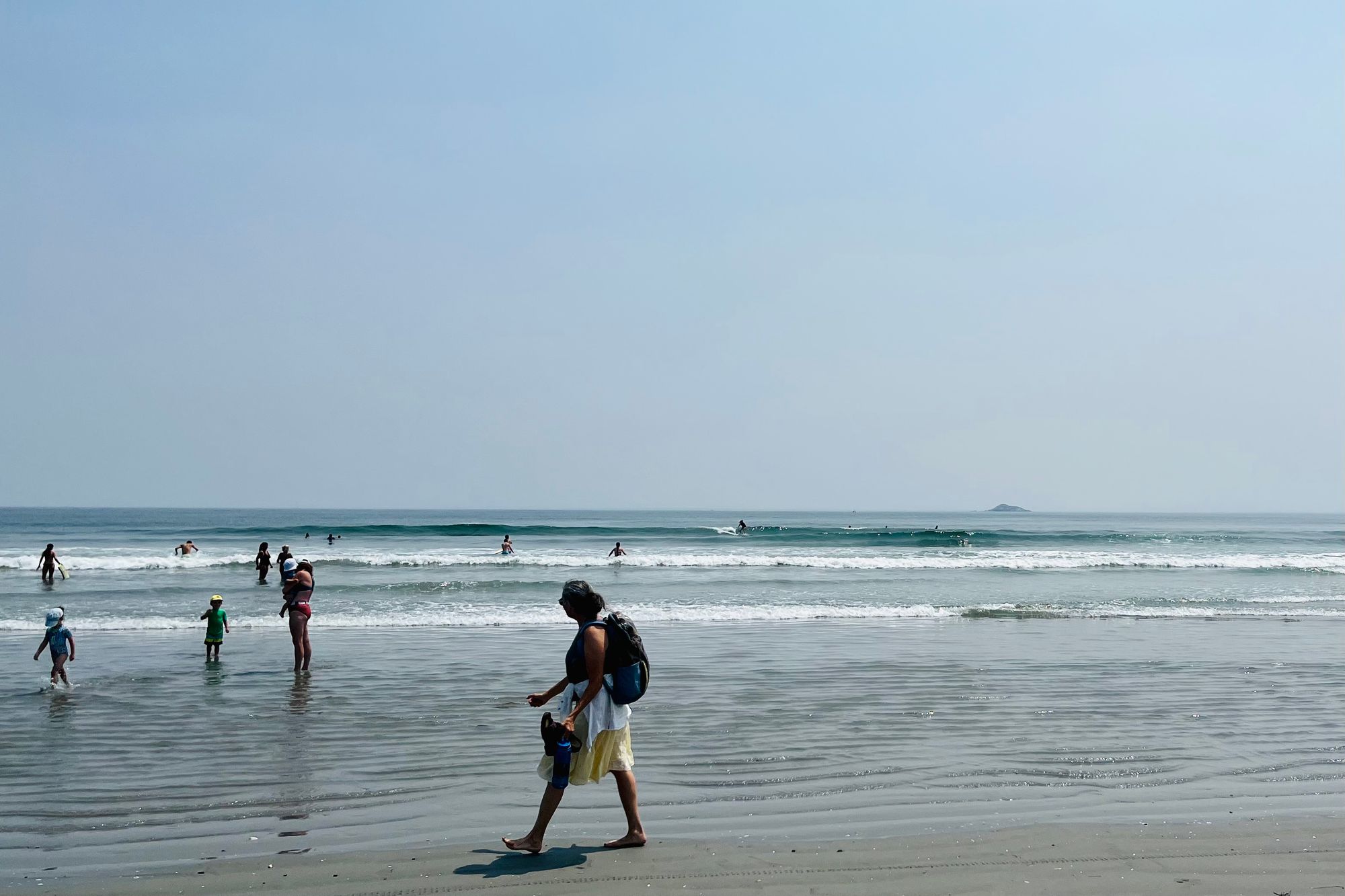 Catching waves between swimmers in Nahant Beach